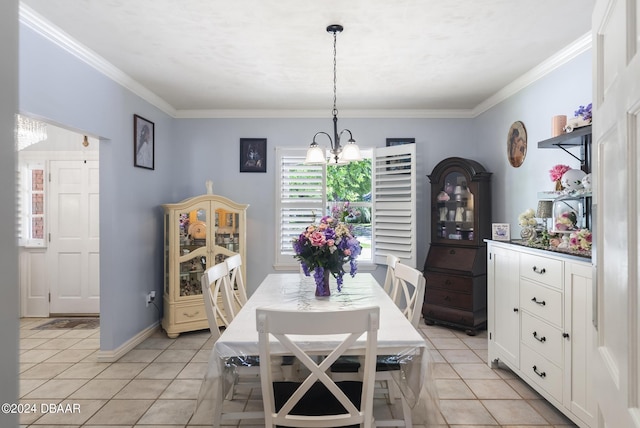 dining space with light tile patterned floors, baseboards, a chandelier, and crown molding