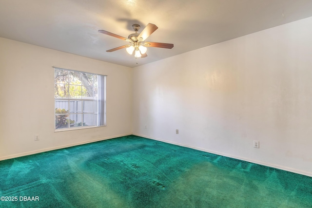 unfurnished room with ceiling fan and carpet flooring