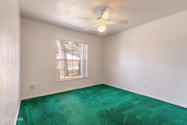 unfurnished room featuring ceiling fan and carpet floors