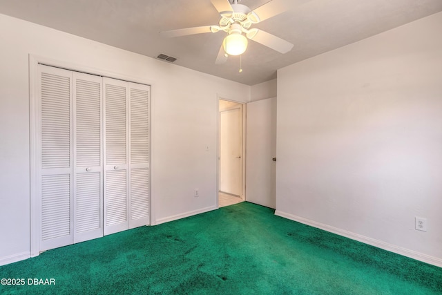 unfurnished bedroom featuring carpet flooring, ceiling fan, and a closet