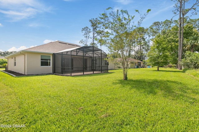 view of yard featuring glass enclosure