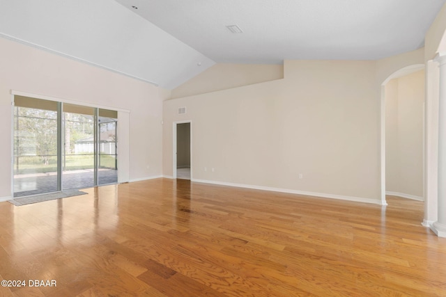 empty room featuring light hardwood / wood-style flooring and lofted ceiling