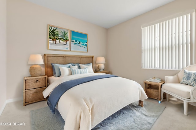 bedroom featuring light colored carpet