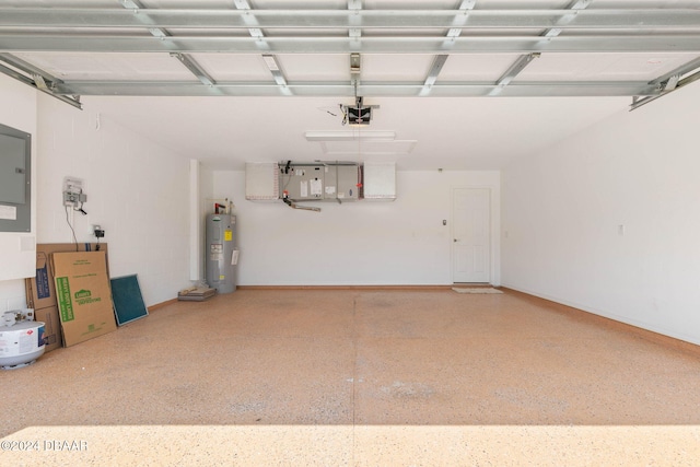 garage with electric water heater and a garage door opener