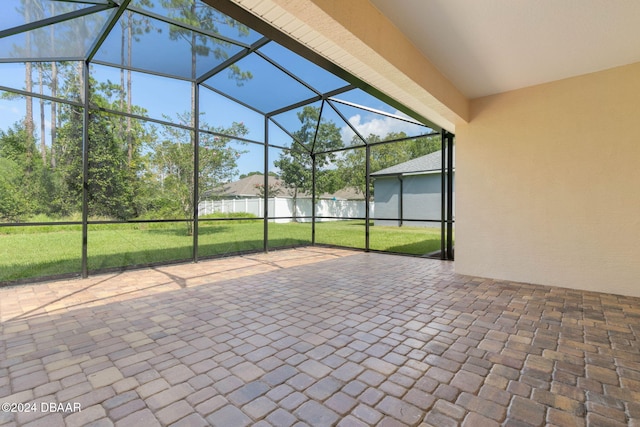 view of patio featuring a lanai