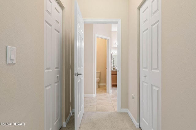 corridor with light colored carpet