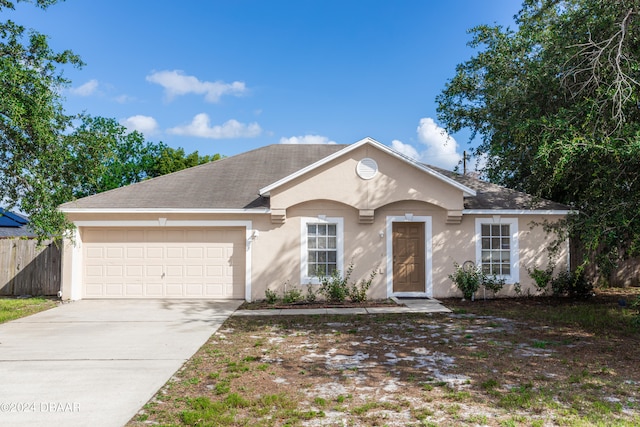 ranch-style house featuring a garage