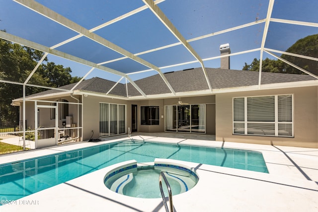 view of swimming pool with an in ground hot tub, a patio, ceiling fan, and a lanai