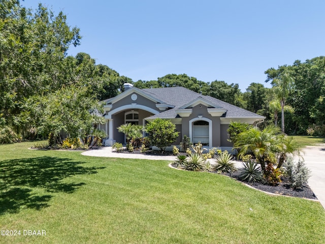 view of front of home with a front yard