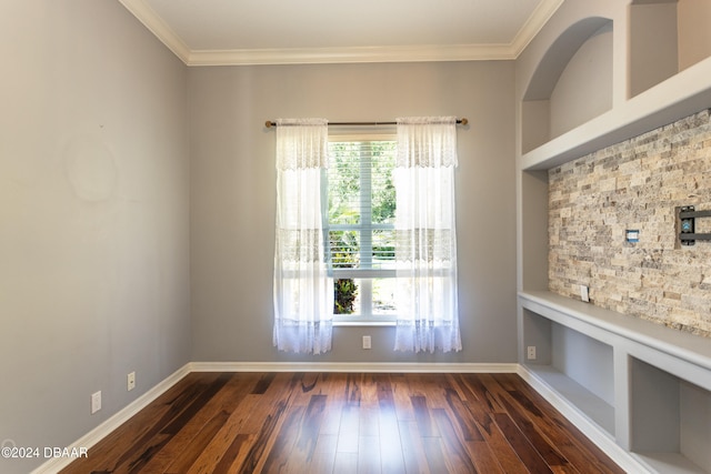 unfurnished dining area featuring crown molding, built in features, and dark hardwood / wood-style floors