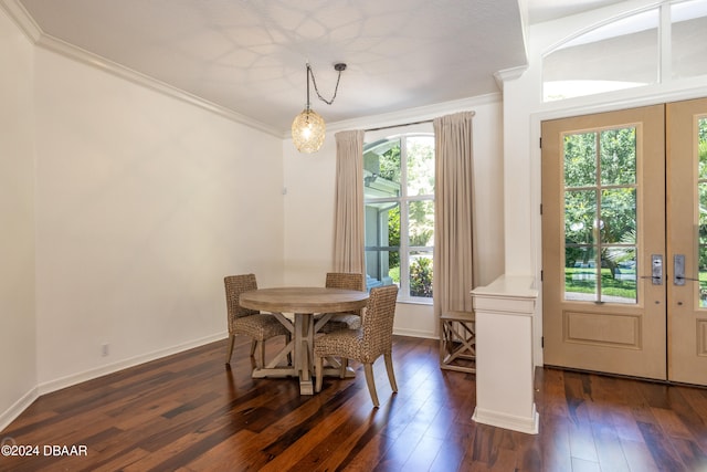 dining space featuring crown molding, french doors, and dark wood-type flooring