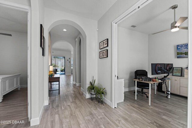 office area with a textured ceiling, ceiling fan, and hardwood / wood-style flooring