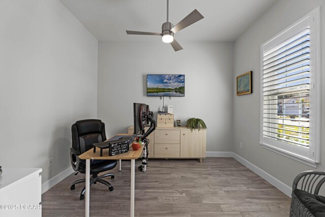 bedroom with ceiling fan and dark wood-type flooring