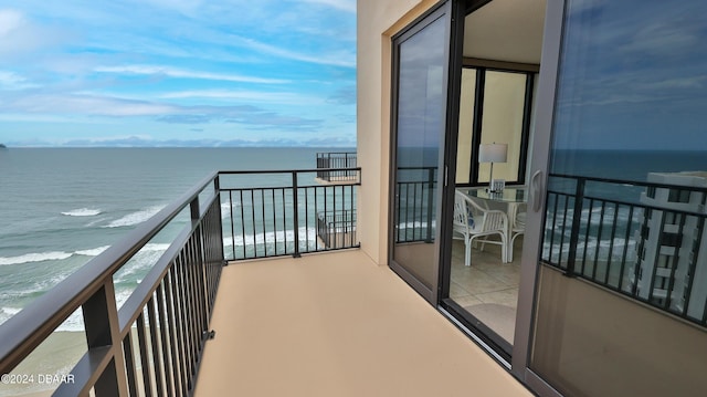 balcony featuring a water view