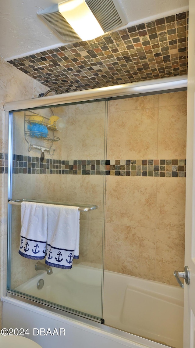 full bathroom featuring shower / bath combination with glass door