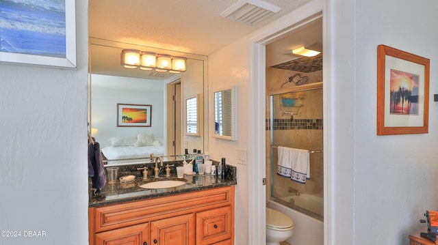 bathroom featuring ensuite bathroom, toilet, bath / shower combo with glass door, vanity, and visible vents