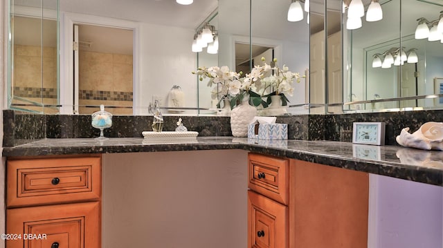 bathroom with decorative backsplash and vanity