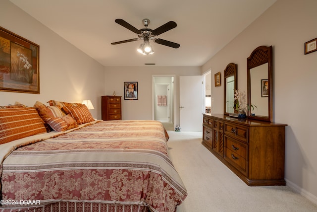 bedroom with light colored carpet and ceiling fan