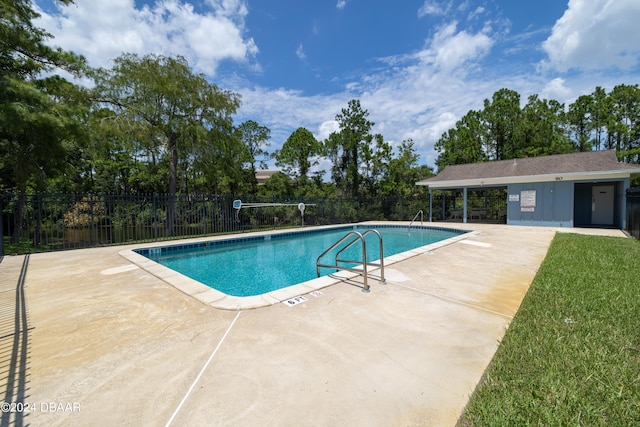 view of swimming pool with a patio