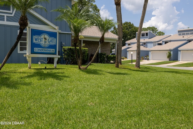 exterior space featuring a lawn and a garage