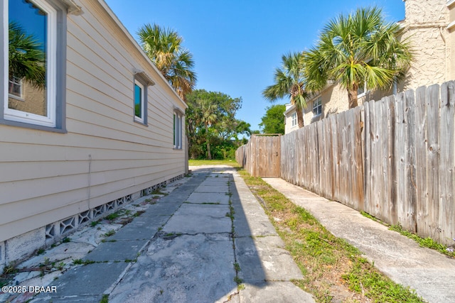 view of property exterior featuring fence
