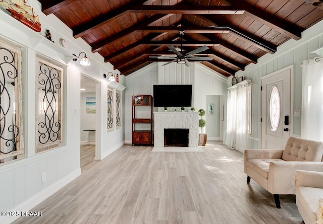 living room with wood ceiling, vaulted ceiling with beams, a ceiling fan, and wood finished floors