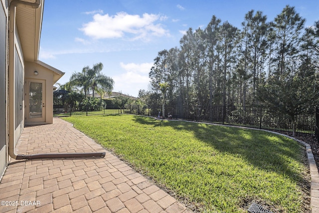 view of yard featuring a patio area and a fenced backyard