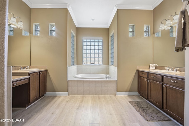 full bathroom with wood finished floors, two vanities, and a sink