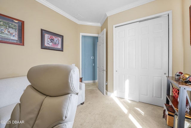 sitting room with baseboards, light colored carpet, and crown molding