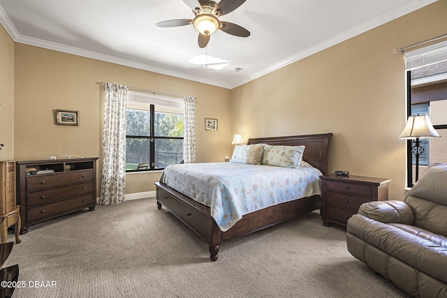 carpeted bedroom with ornamental molding, a ceiling fan, and baseboards