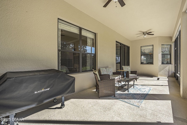 view of patio with grilling area and a ceiling fan