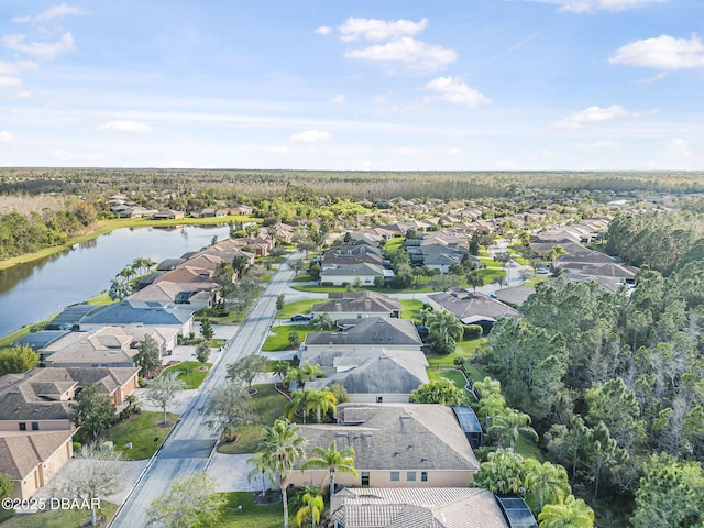 drone / aerial view featuring a residential view and a water view