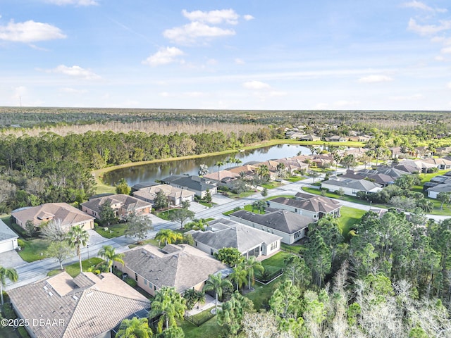 aerial view with a water view, a residential view, and a view of trees