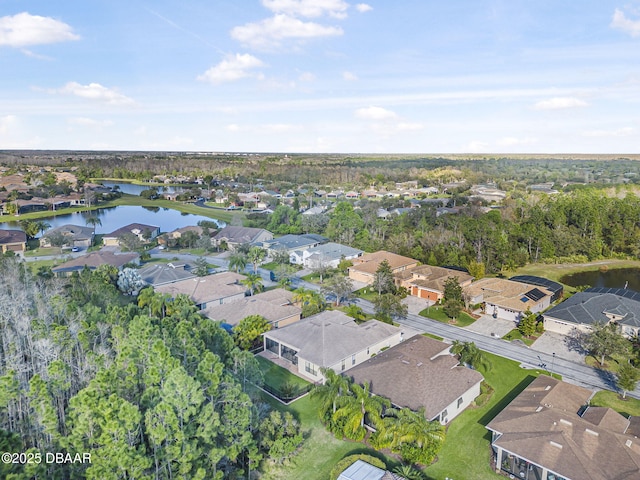 bird's eye view featuring a residential view and a water view