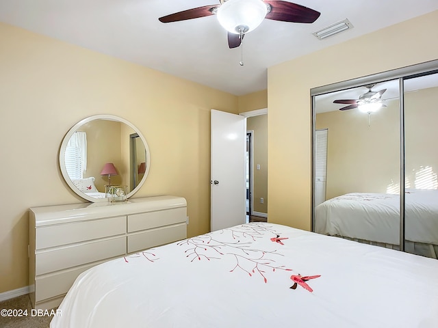 bedroom with ceiling fan, a closet, and carpet floors