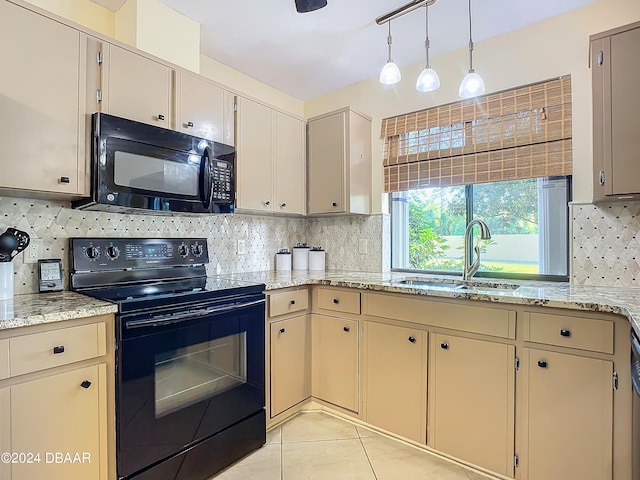 kitchen with black appliances, light tile patterned flooring, decorative light fixtures, decorative backsplash, and sink