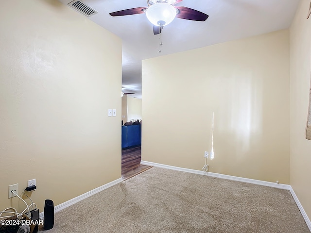 spare room with carpet flooring and ceiling fan