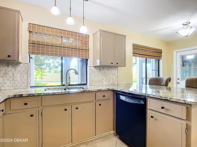 kitchen with black dishwasher, sink, tasteful backsplash, light tile patterned floors, and decorative light fixtures