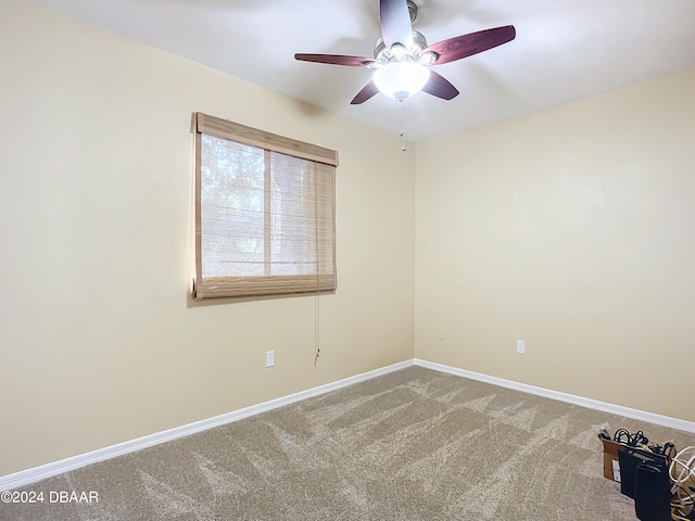 carpeted empty room with ceiling fan