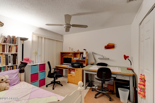 bedroom featuring carpet flooring, a textured ceiling, ceiling fan, and a closet