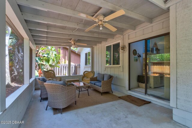 sunroom with an outdoor living space, a ceiling fan, and beam ceiling