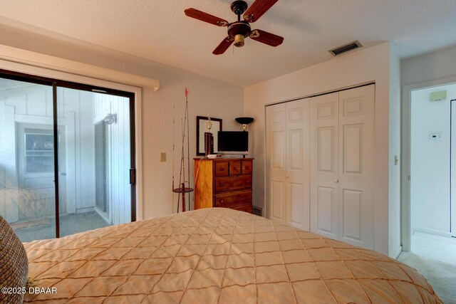 unfurnished bedroom with ceiling fan, visible vents, a closet, access to outside, and carpet flooring