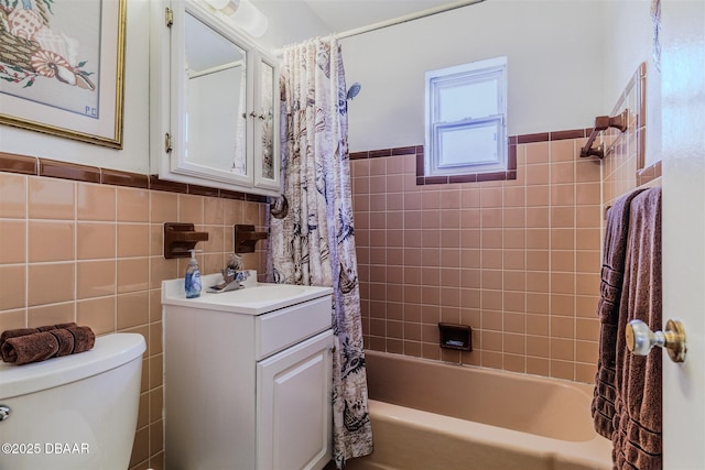 full bathroom featuring vanity, tile walls, shower / bath combination with curtain, and toilet