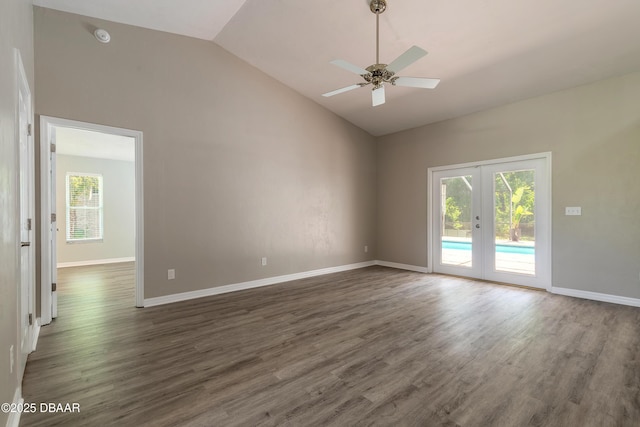 3931 Tano Dr, Ormond Beach, FL 32174 - empty room featuring vaulted ceiling, french doors, dark wood finished floors, a ceiling fan, and baseboards