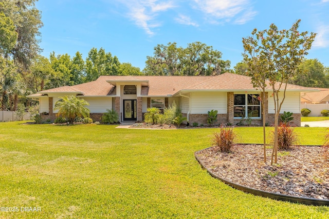 3931 Tano Dr, Ormond Beach, FL 32174 - view of front of home featuring brick siding and roof with shingles