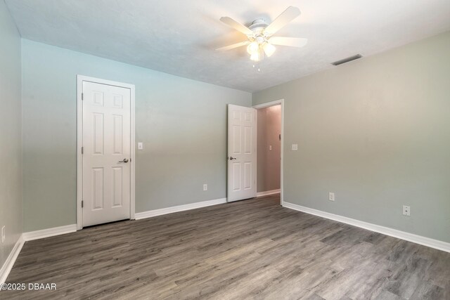 3931 Tano Dr, Ormond Beach, FL 32174 - empty room featuring wood finished floors, a ceiling fan, and baseboards