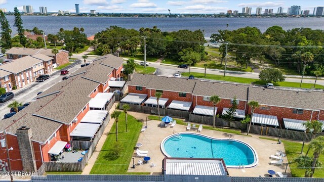 birds eye view of property with a water view