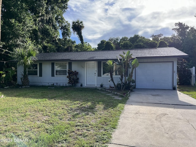 ranch-style home with a front lawn and a garage