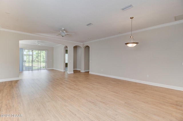 empty room with ceiling fan, light hardwood / wood-style flooring, and crown molding