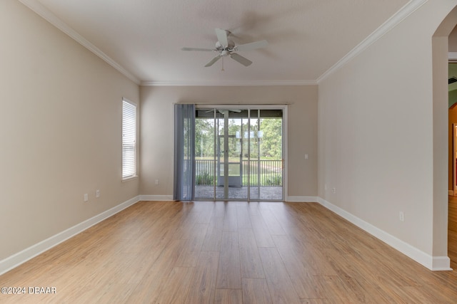 spare room featuring ceiling fan, light hardwood / wood-style flooring, and ornamental molding